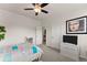 Comfortable bedroom featuring neutral walls, ceiling fan, and cozy decor, offering a serene retreat at 837 Porches Way, Dacula, GA 30019