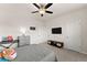 Cozy bedroom featuring neutral carpet, ceiling fan, and closet access at 837 Porches Way, Dacula, GA 30019
