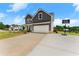 A beautiful two-story home with an attached two-car garage, driveway, and well-kept lawn at 837 Porches Way, Dacula, GA 30019