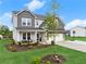Charming two-story home with a well-manicured lawn, a basketball hoop, and a two-car garage at 837 Porches Way, Dacula, GA 30019