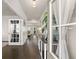 Elegant foyer featuring hardwood floors, paneled doors, and natural light, creating a welcoming ambiance at 837 Porches Way, Dacula, GA 30019