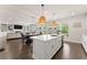 Spacious kitchen with island and open concept to dining and living area at 837 Porches Way, Dacula, GA 30019