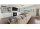 Bright living room features a fireplace, built-in shelving, and a large sectional sofa at 837 Porches Way, Dacula, GA 30019