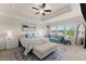 Serene main bedroom features a sitting area with a daybed and ample natural light at 837 Porches Way, Dacula, GA 30019