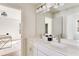 Bathroom with double vanity sinks and a large mirror offering plenty of light at 919 East Green Ln, Clarkston, GA 30021