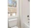 Bright bathroom with a shower and a window, offering a refreshing view of the outdoors at 919 East Green Ln, Clarkston, GA 30021