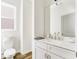 Modern half-bathroom with a floating vanity, marble countertops, and stylish fixtures at 919 East Green Ln, Clarkston, GA 30021