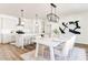 Open concept kitchen and dining area with modern light fixtures and decor at 919 East Green Ln, Clarkston, GA 30021
