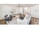 Bright living room with modern decor, hardwood floors, and an open floor plan at 919 East Green Ln, Clarkston, GA 30021