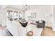 Sun-filled living room featuring stylish furniture, hardwood floors, and neutral color palette at 919 East Green Ln, Clarkston, GA 30021