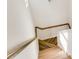 Modern staircase with wood railing and treads, adding warmth to the home at 919 East Green Ln, Clarkston, GA 30021