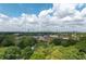 Distant view of a city skyline past trees and buildings at 210 Locust Ne St, Atlanta, GA 30317