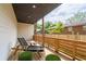 Back porch featuring a wooden chair and string lights hanging along the railing at 210 Locust Ne St, Atlanta, GA 30317