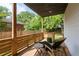 Back porch featuring a wooden chair and string lights hanging along the railing at 210 Locust Ne St, Atlanta, GA 30317