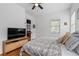 Comfortable bedroom with a ceiling fan and window that allows natural light to fill the room at 210 Locust Ne St, Atlanta, GA 30317