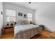 Serene bedroom with a comfortable bed and windows dressed with blinds that allow light to fill the room at 210 Locust Ne St, Atlanta, GA 30317
