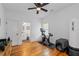 Bedroom with hardwood floors featuring an exercise bike and workout equipment at 210 Locust Ne St, Atlanta, GA 30317