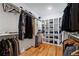 Walk-in closet with custom shelving, hanging rods, and ample storage space at 210 Locust Ne St, Atlanta, GA 30317