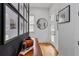 Bright entryway featuring hardwood floors, stylish decor, and a gallery wall, creating a welcoming ambiance at 210 Locust Ne St, Atlanta, GA 30317