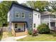 Charming two-story home with a modern design, landscaping, and a welcoming front porch at 210 Locust Ne St, Atlanta, GA 30317