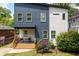 Charming two-story home with a modern design, landscaping, and a welcoming front porch at 210 Locust Ne St, Atlanta, GA 30317