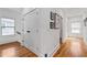 Hallway features hardwood floors, white walls, and a double door closet at 210 Locust Ne St, Atlanta, GA 30317