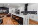 Open concept kitchen with large island, modern appliances, and seamless connection to the living area at 210 Locust Ne St, Atlanta, GA 30317