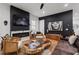 Chic living room with a modern fireplace, hardwood floors, and contemporary decor, blending style and comfort at 210 Locust Ne St, Atlanta, GA 30317