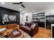 Stylish living room featuring a sleek bar area, hardwood floors, and modern decor, perfect for entertaining at 210 Locust Ne St, Atlanta, GA 30317