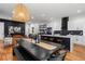 Open concept living space joining the kitchen and dining area with modern décor and an inviting ambiance at 210 Locust Ne St, Atlanta, GA 30317