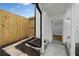 A fenced backyard offers a mix of gravel and paving stones at 130 Oakcliff Court, Atlanta, GA 30331