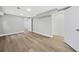 A finished basement boasts durable wood-look floors, neutral gray walls, and recessed lighting at 130 Oakcliff Court, Atlanta, GA 30331