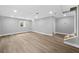 Finished basement with wood-look floors, recessed lights, stairs and bright, neutral paint at 130 Oakcliff Court, Atlanta, GA 30331