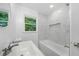 Bright bathroom featuring modern fixtures, including a tub and vanity at 130 Oakcliff Court, Atlanta, GA 30331