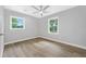 Bedroom with a ceiling fan, two windows and neutral tones at 130 Oakcliff Court, Atlanta, GA 30331