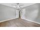 Neutral bedroom with a ceiling fan and two doors leading to other rooms at 130 Oakcliff Court, Atlanta, GA 30331