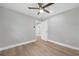 Bedroom with a ceiling fan and light hardwood floors at 130 Oakcliff Court, Atlanta, GA 30331