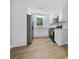 Updated kitchen features white cabinets, stainless steel appliances, and hardwood floors at 130 Oakcliff Court, Atlanta, GA 30331