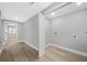 Laundry room with wood-look floors and a separate laundry area at 130 Oakcliff Court, Atlanta, GA 30331