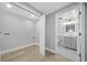 Laundry room with bright lighting near a bathroom with gray vanity at 130 Oakcliff Court, Atlanta, GA 30331
