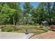 Expansive backyard features a playset, storage shed, and lush landscaping at 1922 Olde Village Run, Dunwoody, GA 30338