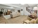 Basement living area featuring a sofa, decorative furniture, and staircase at 1922 Olde Village Run, Dunwoody, GA 30338