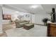 Basement living area showcasing a neutral sofa, accent chairs, and a walkout door at 1922 Olde Village Run, Dunwoody, GA 30338