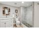 Bathroom with white cabinets, a marble countertop, and a glass-enclosed shower at 1922 Olde Village Run, Dunwoody, GA 30338