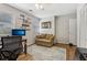 Bedroom with wood floors, ceiling fan, and view of two windows and adjacent closet, perfect for study or  at 1922 Olde Village Run, Dunwoody, GA 30338