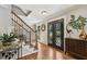 Inviting foyer with hardwood floors, staircase, and decorative accents at 1922 Olde Village Run, Dunwoody, GA 30338
