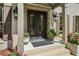 Elegant front entrance featuring double doors with decorative glass inserts and brick steps at 1922 Olde Village Run, Dunwoody, GA 30338