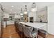 Open kitchen featuring a large island with seating and modern appliances at 1922 Olde Village Run, Dunwoody, GA 30338