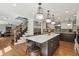 Spacious kitchen featuring stainless steel appliances, a central island, and abundant natural light at 1922 Olde Village Run, Dunwoody, GA 30338