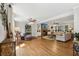 Spacious living room with hardwood floors, stone fireplace, built-in shelves, and neutral color palette at 1922 Olde Village Run, Dunwoody, GA 30338